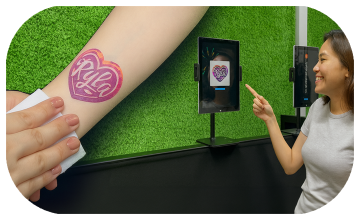 Guests creating their own AI Tattoos at exhibition in Dubai